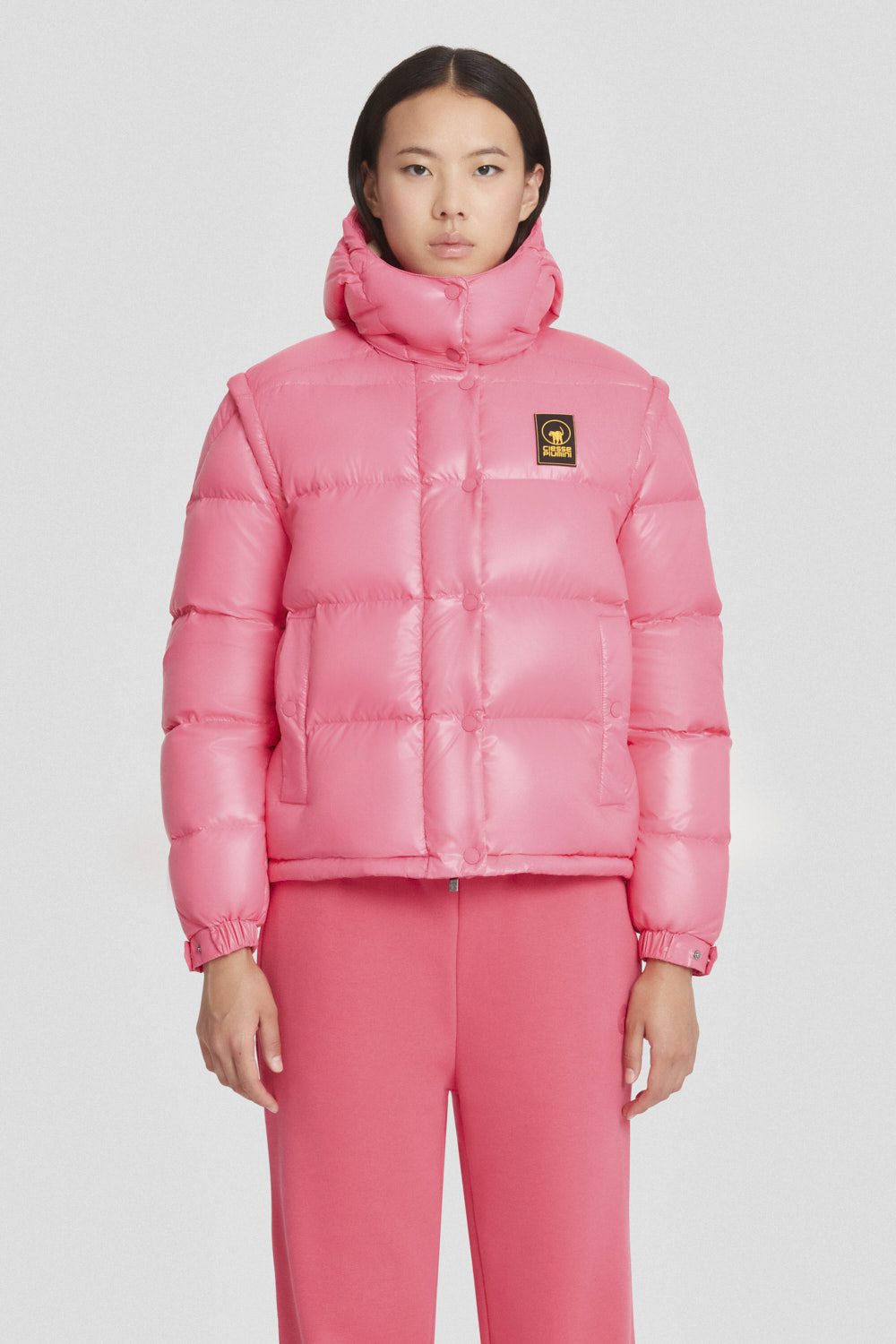 Piumino Ciesse trapuntato fucsia con cappuccio e maniche staccabili